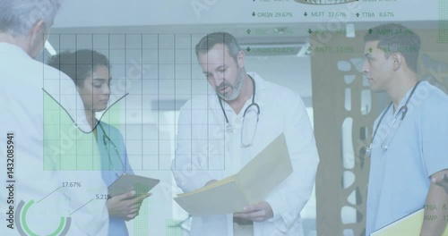 Healthcare team consulting in clinic, showcasing floating charts and graphs for medical analysis