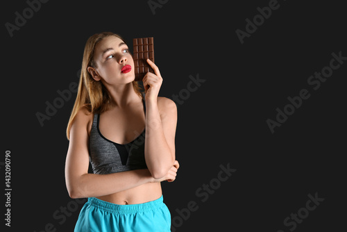 Thoughtful young woman with...
