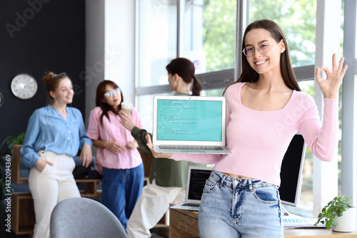 Female programmer with lapt...
