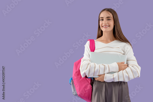 Happy female student with b...