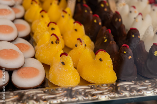 Photography Various Easter-themed confectionery, marmalade chickens, chocolates and eggs, on