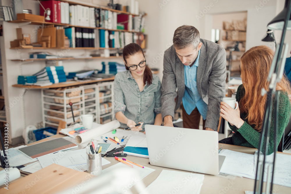 Group of people working together on a project in a startup company office
