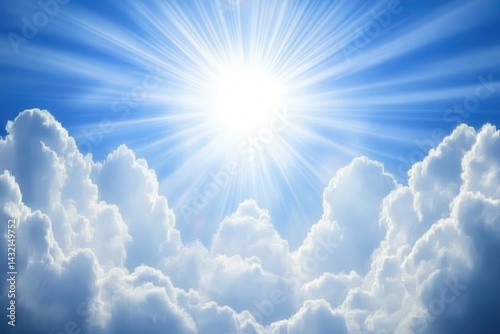 Radiant sun behind fluffy clouds