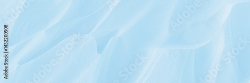Obraz na płótnie Snow texture. Wind sculpted patterns on snow surface. Wind in the tundra and in the mountains on the surface of the snow sculpts patterns and ridges (sastrugi). Arctic, Polar region. Winter background w salonie