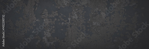 Obraz na płótnie Dark wide panoramic background. Peeling paint on a concrete wall. Faded dark texture of old cracked flaking paint. Weathered rough painted surface with patterns of cracks. Shaded background for design w salonie