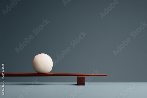 Obraz na płótnie Delicate Daifuku Mochi Balancing on a Wooden Plank Minimalist Studio Setting Aesthetic Food Photography w salonie