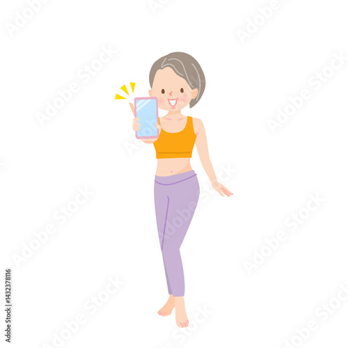 スマホの画面を見せるミドル女性インストラクター