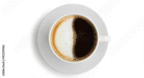 Overhead view of a cup of coffee split in half with milk and coffee on a white background surface