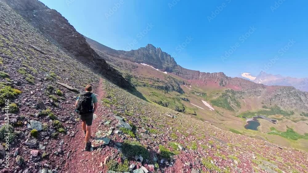Following Man Backpackig up Red Eagle Pass in Glacier National Park