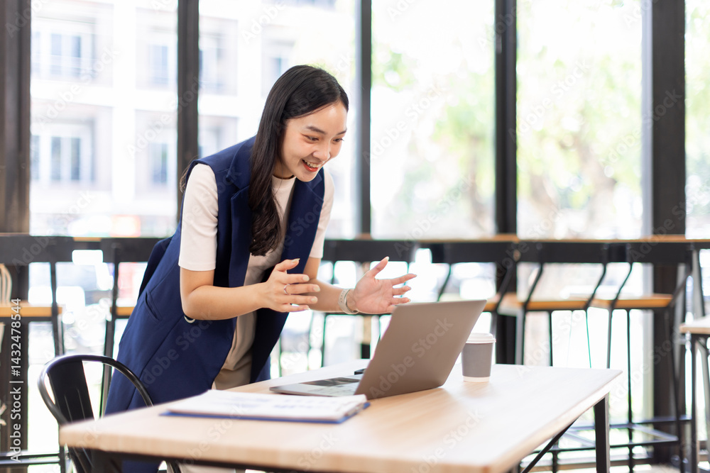 Fototapeta premium asian business woman sit at laptop holding papers, read received contract, agreement, legal documents smile feel satisfied, got good news. Loan repayment, career advance, success concept 