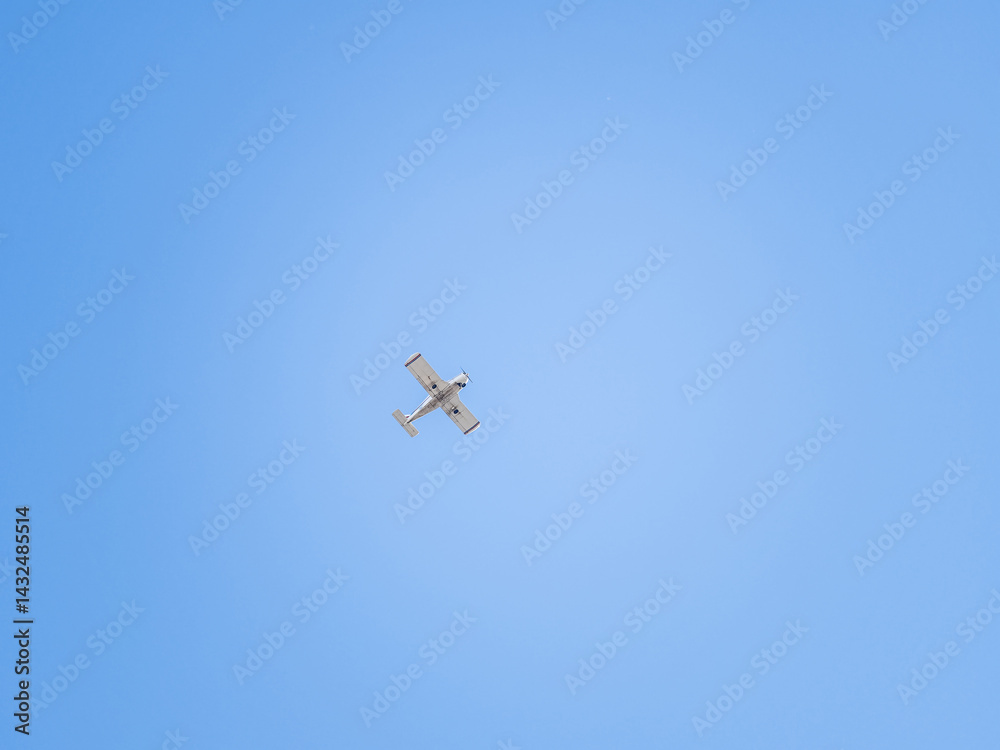 Small ultralight airplane with overhead wing and single propeller flying in sunset sky. Small ultralight airplane with overhead wing and single propeller flying in sunset sky.