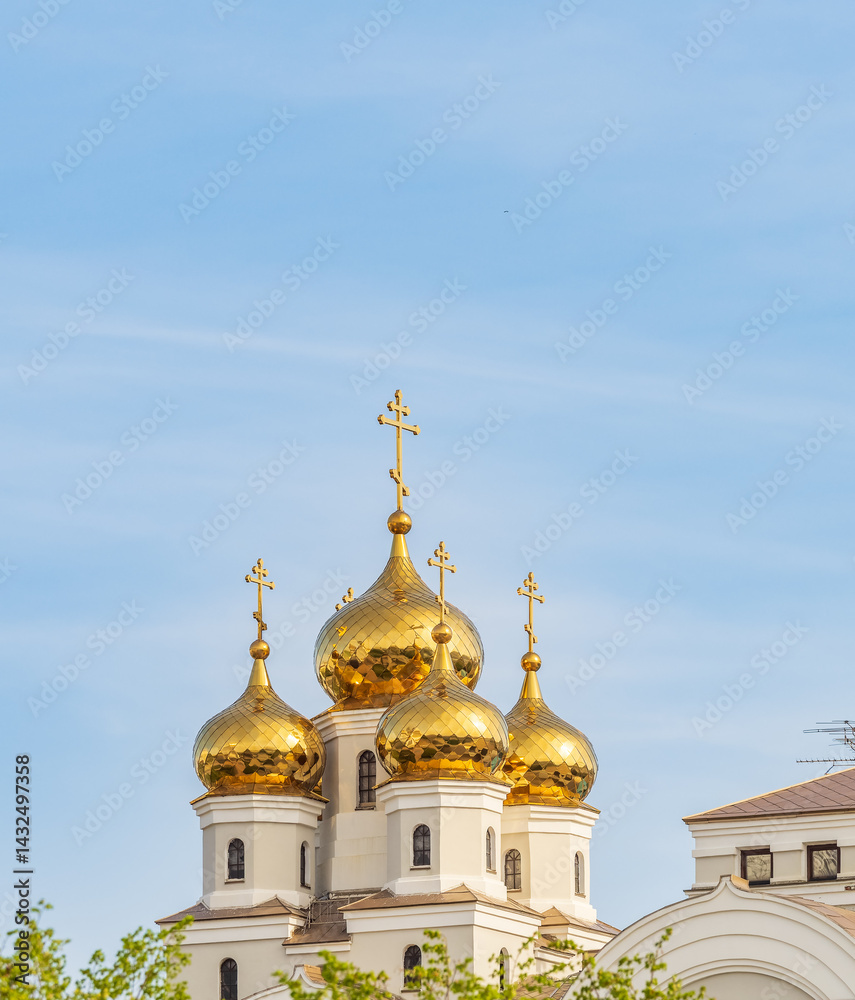 The golden domes of the Christian church in sunset light. The golden domes of the Christian church in sunset light.