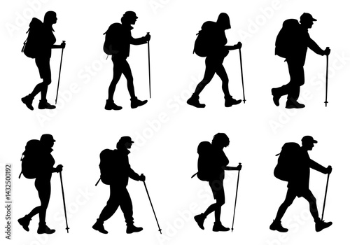Silhouettes of hikers with backpacks and trekking poles