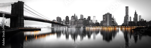 Dramatic black and white panoramic view of new york city skyline with bridge