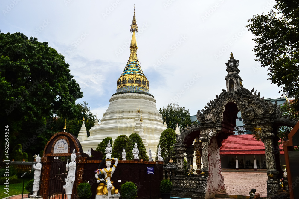 Fototapeta premium Pagoda and Chapel, Lanna Architecture, Symbols of Buddhism, South East Asia at Wat Buppharam, Chiang Mai, Northern Thailand