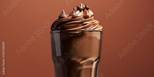 A cup of chocolate ice cream with chocolate on it on the baron background. 
