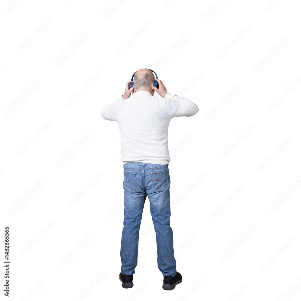 a man standing with a pair of headphones on his ears
