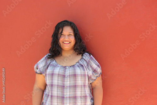 25-year-old single Latina brunette woman with curly hair shows herself to be happy, empowered, successful, and living a full life