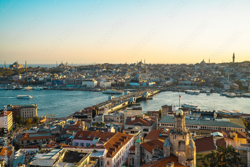 Naklejka premium Galata Bridge. Istanbul Galata Bridge, buildings and traffic taken with a drone. Wide angle aerial view at sunset. Istanbul, Turkey