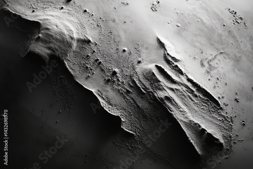 Abstract grayscale depiction of textured surface formations.