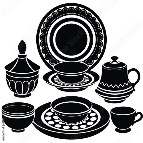 Black and white vintage ceramic dishes, cups, plates, and bowls set with floral and ornamental decorative patterns