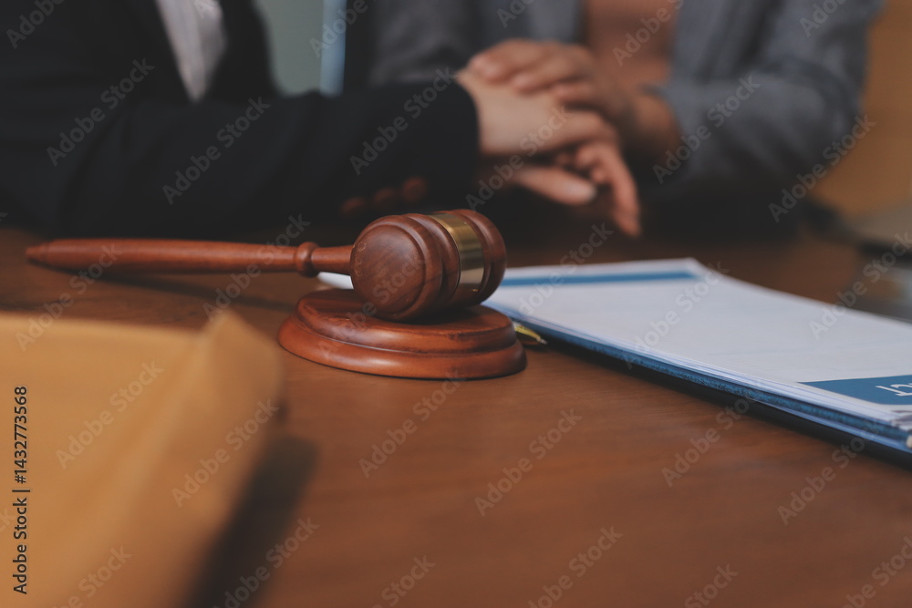 Judge gavel with Justice lawyers having team meeting at law firm background. Concepts of Law and Legal services. Judge gavel with Justice lawyers having team meeting at law firm background. Concepts of Law and Legal services.