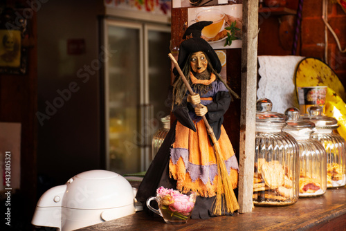 Photos Old woman witch figurine and haunted house cafe coffee shop in garden outdoor on