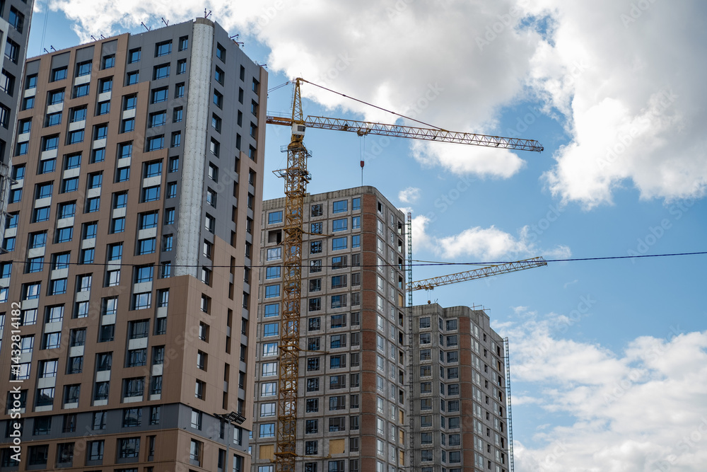 Construction crane on Housing. Construction of the Multi Storey Residential Building. Construction of a skyscraper. Tower Crane on formworks on construction site. Buildings under construct. Construction crane on Housing. Construction of the Multi Storey Residential Building. Construction of a skyscraper. Tower Crane on formworks on construction site. Buildings under construct.
