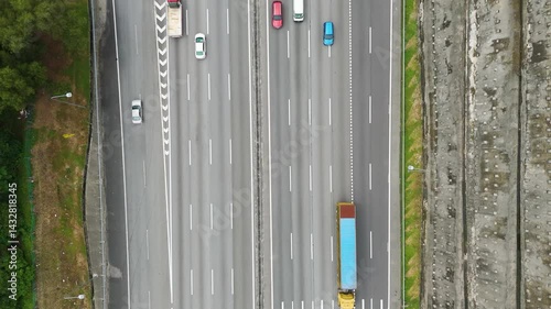 Aerial: highway with cars and traffic during the day in Petaling Jaya, in the state of Selangor, Malaysia, top-down drone shot photo