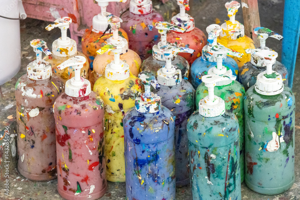 Colorful, paint-stained containers for oil painting