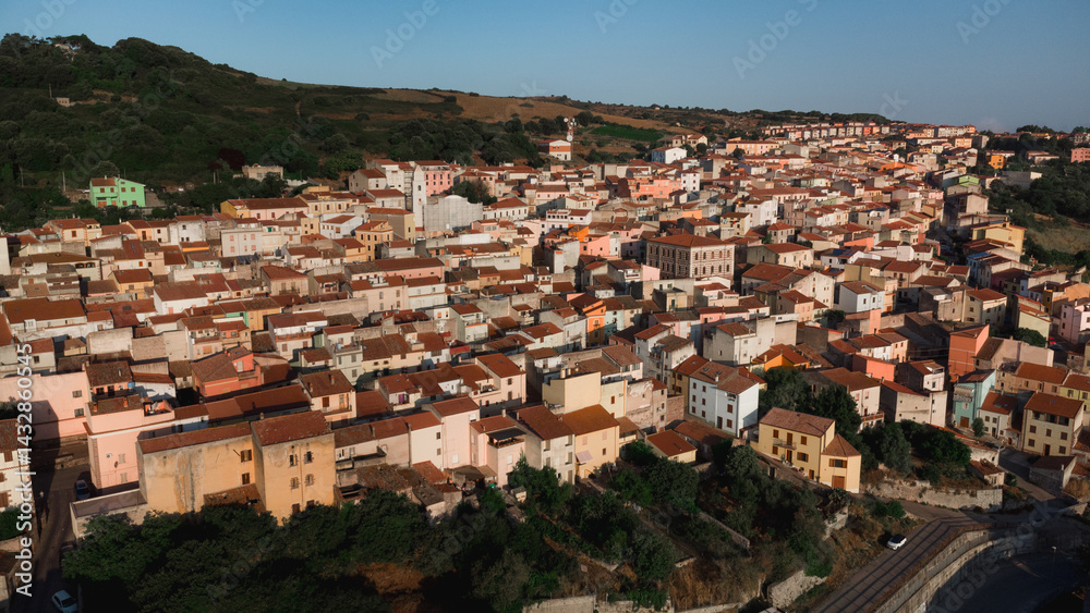 Fototapeta premium Panoramic view of a picturesque town in sardinia, italy, during sunset