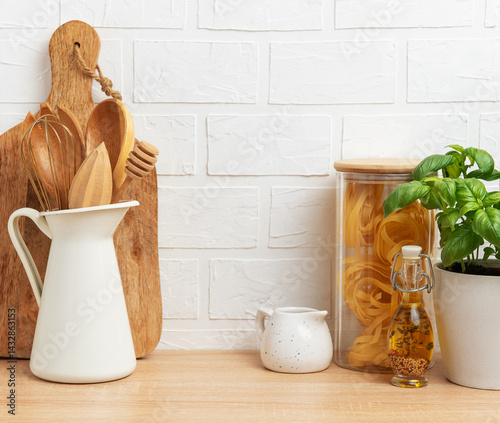 Obraz na płótnie Kitchen utensils, pasta and basil showing rustic cooking and healthy food concept w salonie