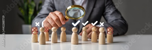 Careful selection of candidates using a magnifying glass.