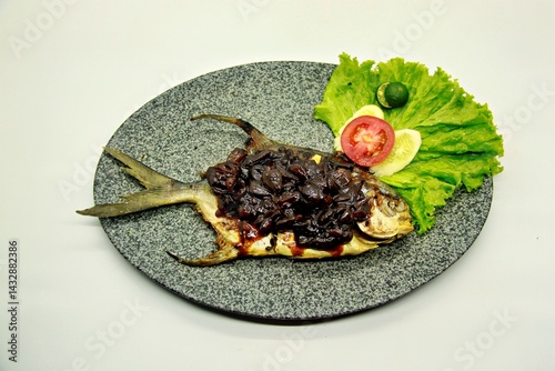 Grilled spadefish (bawal bintang) with rich Parape sauce, a traditional Indonesian dish known for its bold, sweet-savory flavor and aromatic spices.