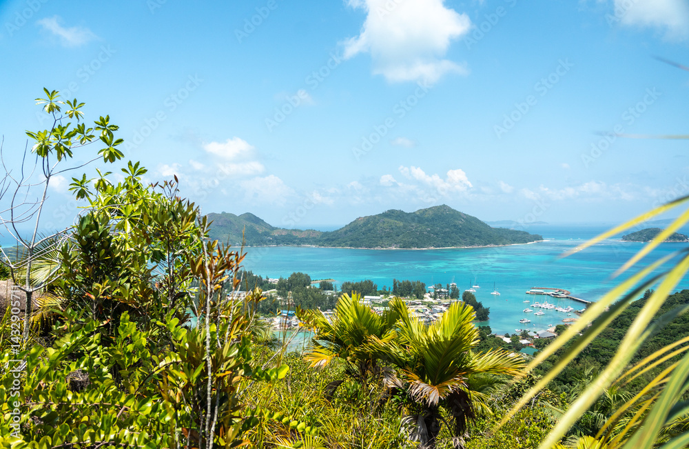 Scenic midday view from a tropical hilltop on Praslin Island, Seychelles