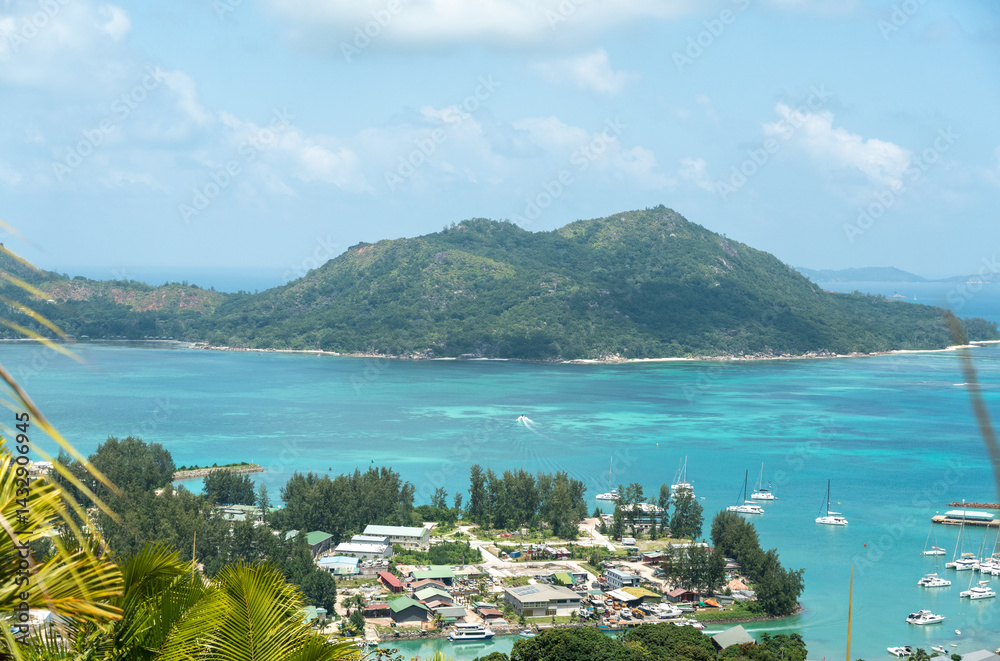 Tropical aerial view of Baie Sainte Anne on Praslin Island, Seychelles, with green hills