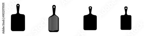Different styles of black kitchen spatulas arranged side by side for culinary use in modern cooking