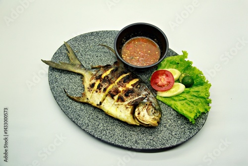 Grilled spadefish (bawal bintang) served with spicy seafood sambal. A savory Indonesian dish rich in flavor, perfect for traditional seafood lovers.