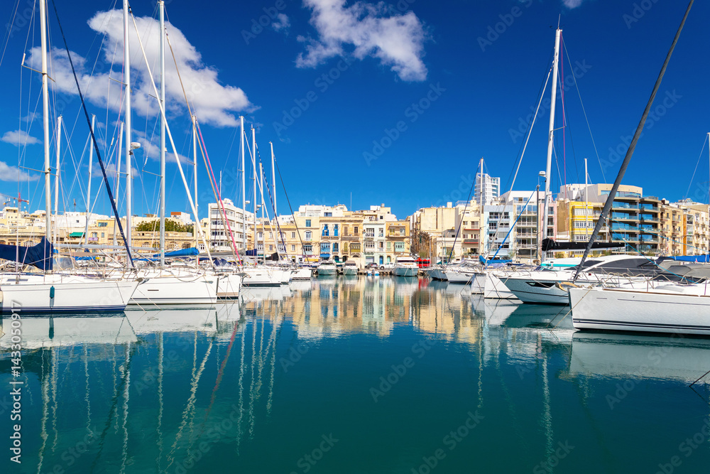 Beautiful cityscape of the Ta Xbiex bay with yachts lying on water, Malta
