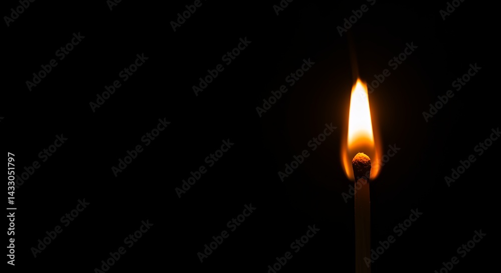 Matchstick flame isolated on dark background Matchstick flame isolated on dark background