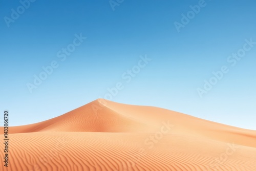 Desert sand dune under clear sky