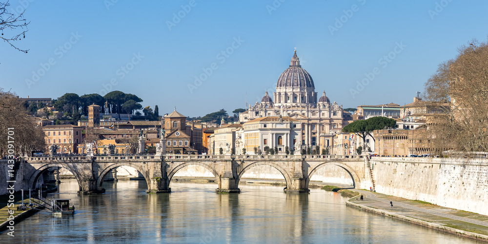 Rome skyline with St. Peter's Basilica in Vatican panorama Ponte Sant'Angelo bridge over Tiber river in Italy