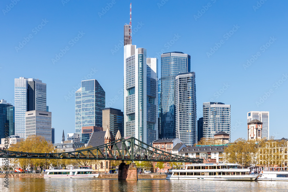 Frankfurt skyline skyscrapers with banks on River Main with excursion boats in Frankfurt, Germany