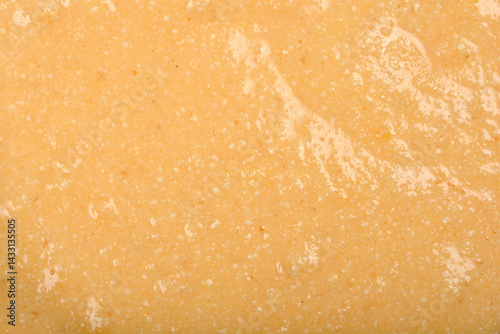 Obraz na płótnie A textured, pale yellow mixture of eggs and semolina is shown in a detailed close-up, ready to be formed into dumplings for soup w salonie