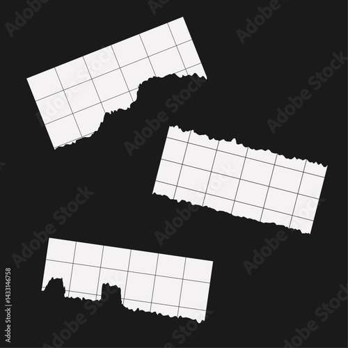 Torn out paper pieces on black
