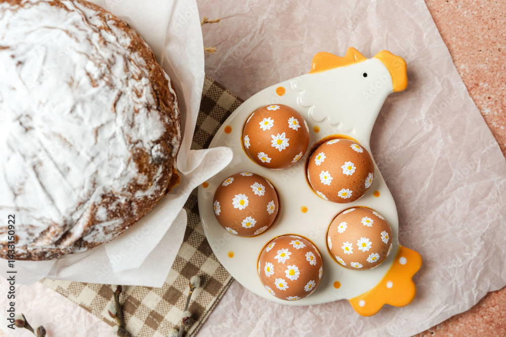Easter cake and decorated brown eggs with white daisy flowers on ceramic chicken tray. Soft festive still life. Perfect for Easter table concept.