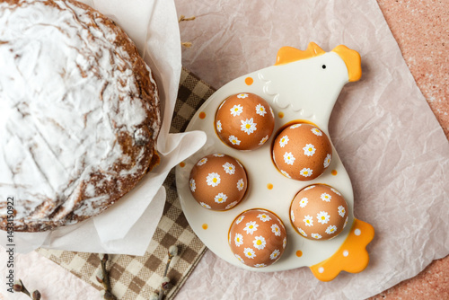 Obraz na płótnie Easter cake and decorated brown eggs with white daisy flowers on ceramic chicken tray. Soft festive still life. Perfect for Easter table concept. w salonie