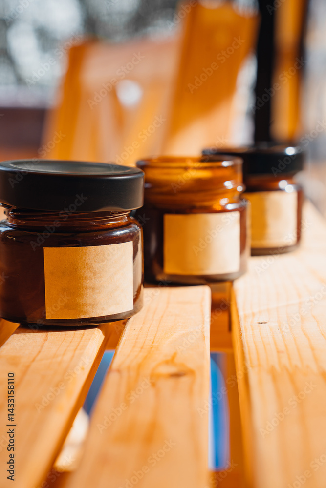 Scented candles on a wooden table.