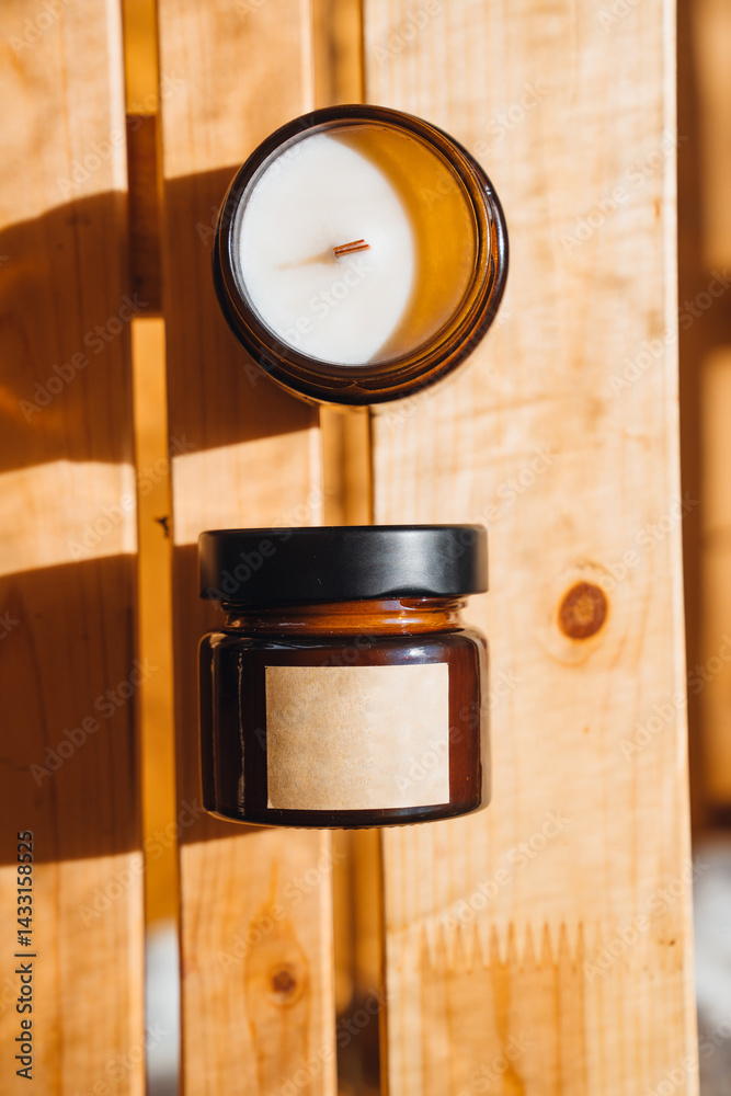 Scented candles on a wooden table.