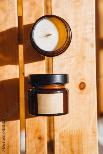 Scented candles on a wooden table. 